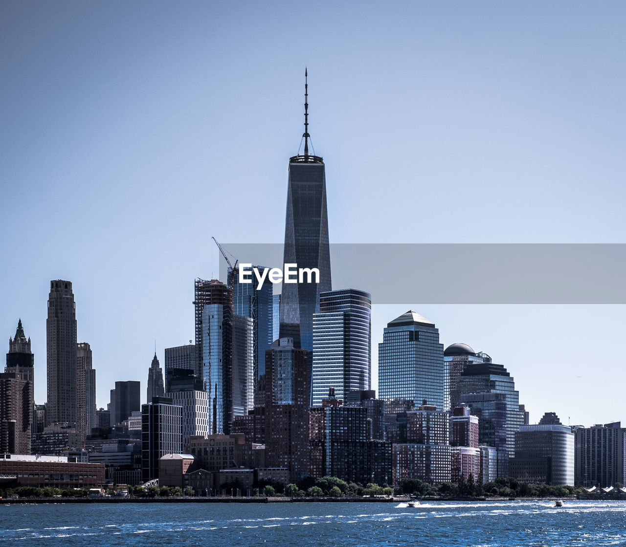 Modern buildings in city against clear sky