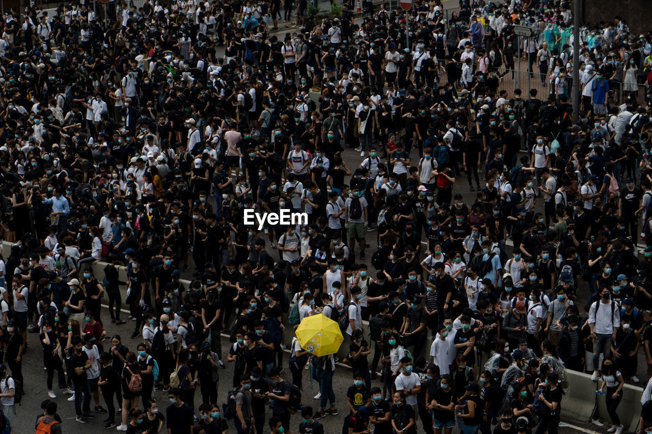 High angle view of crowd standing on road