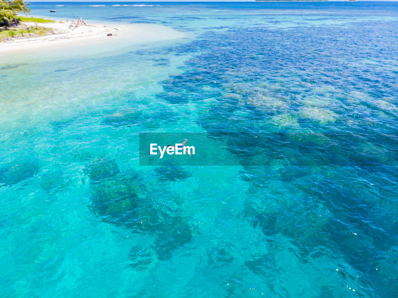 HIGH ANGLE VIEW OF SWIMMING UNDERWATER IN SEA