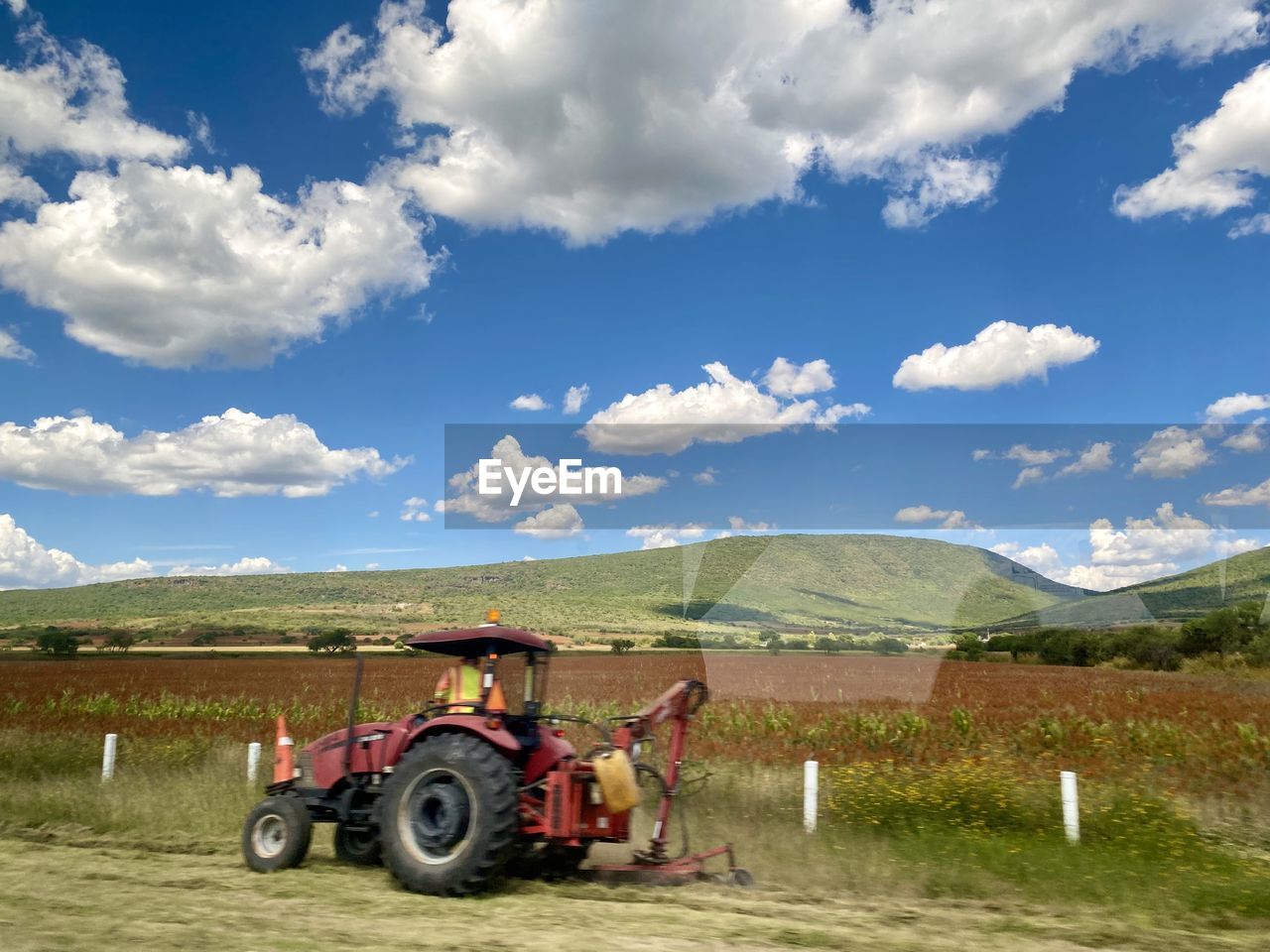 TRACTOR ON AGRICULTURAL FIELD