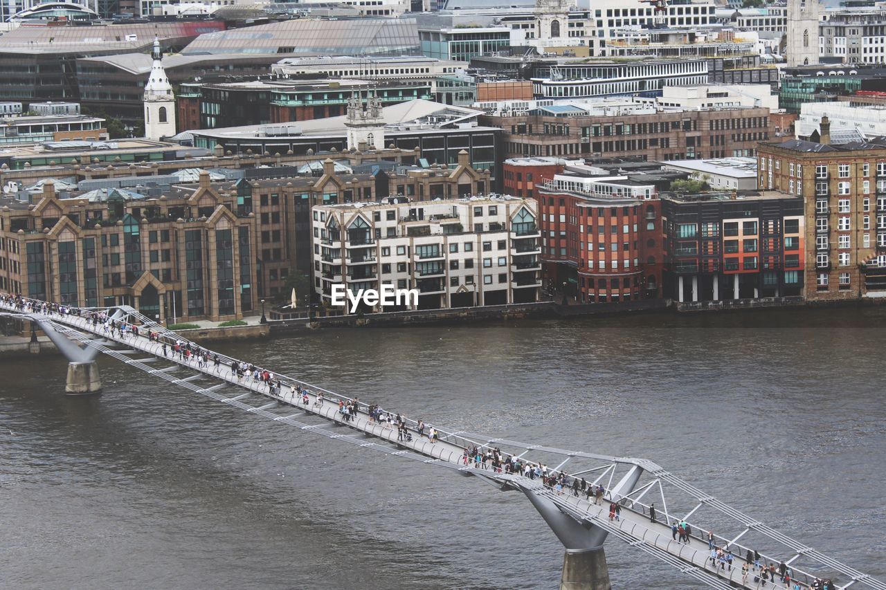 High angle view of people walking on london millennium footbridge over thames river
