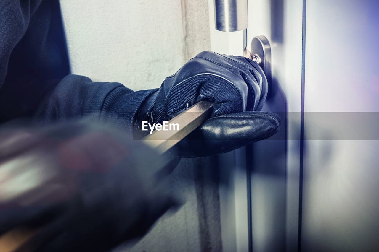 Close-up of man breaking into home