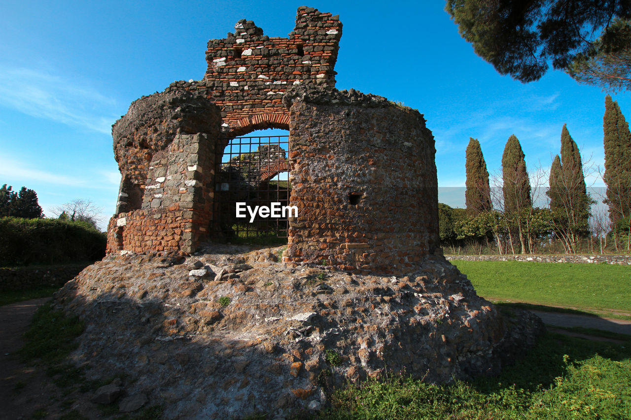 Appia antica, rome, pines and ruins of ancient