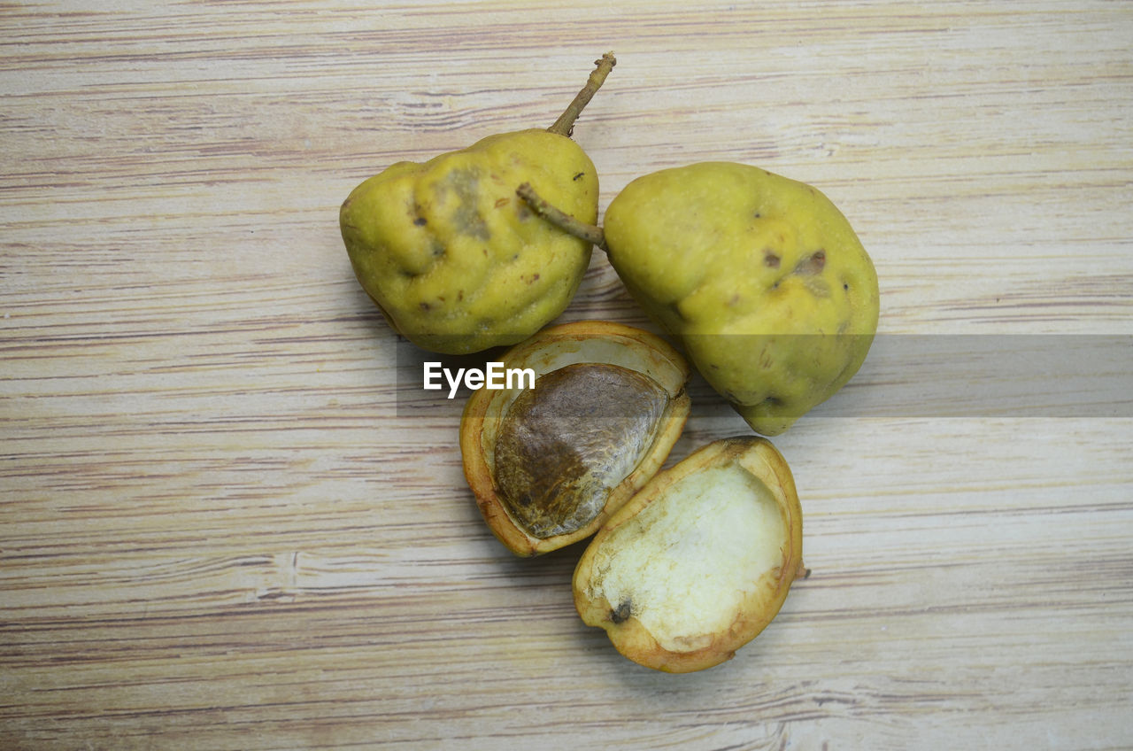Opened nam nam fruit on wooden table background