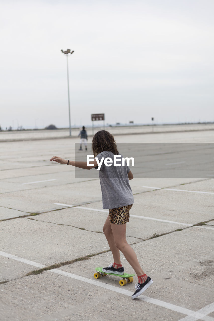 Young woman skateboarding