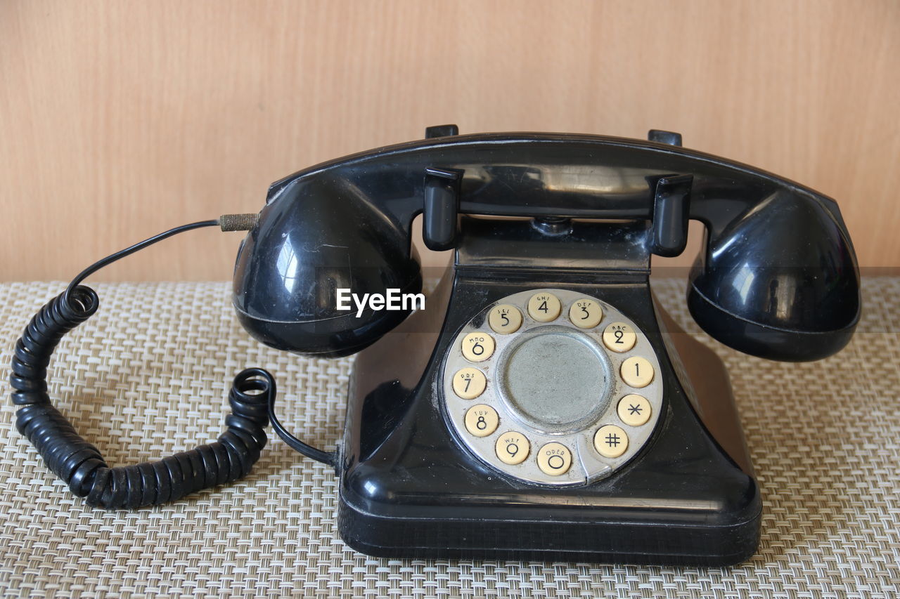 High angle view of telephone on table