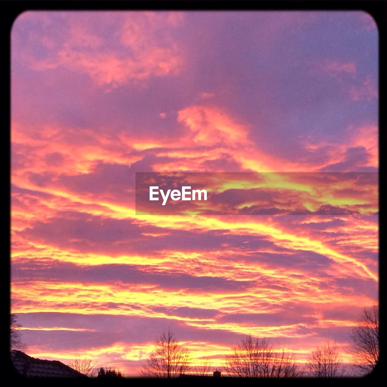 Low angle view of cloudy sky during sunset