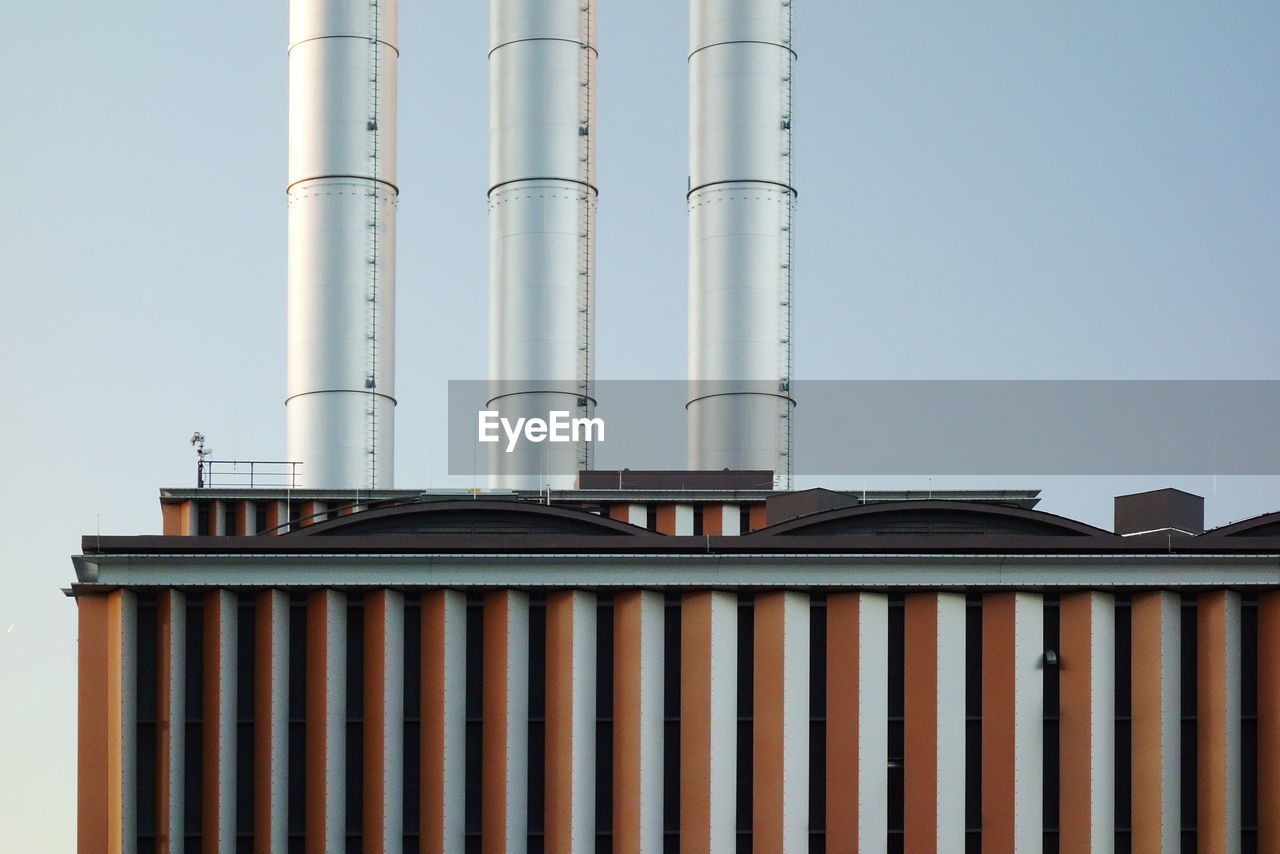 LOW ANGLE VIEW OF INDUSTRY AGAINST SKY