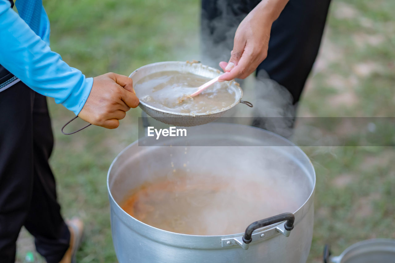 Midsection of man preparing food