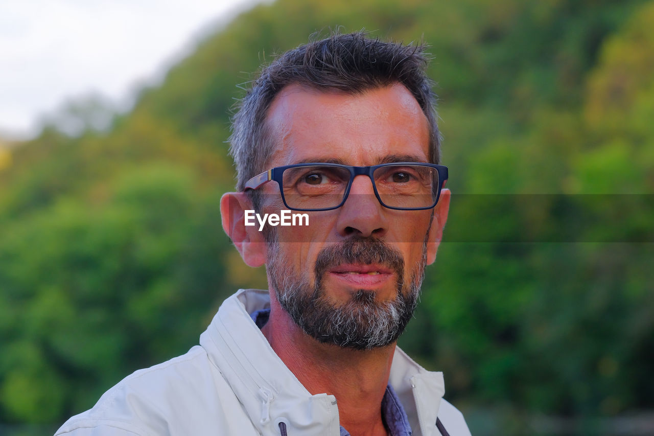 Portrait of man wearing eyeglasses