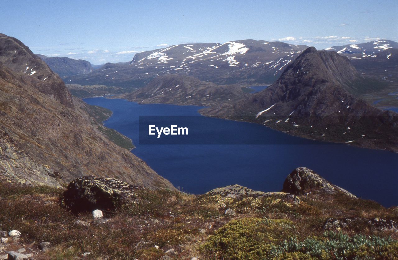 SCENIC VIEW OF LAKE AGAINST MOUNTAIN