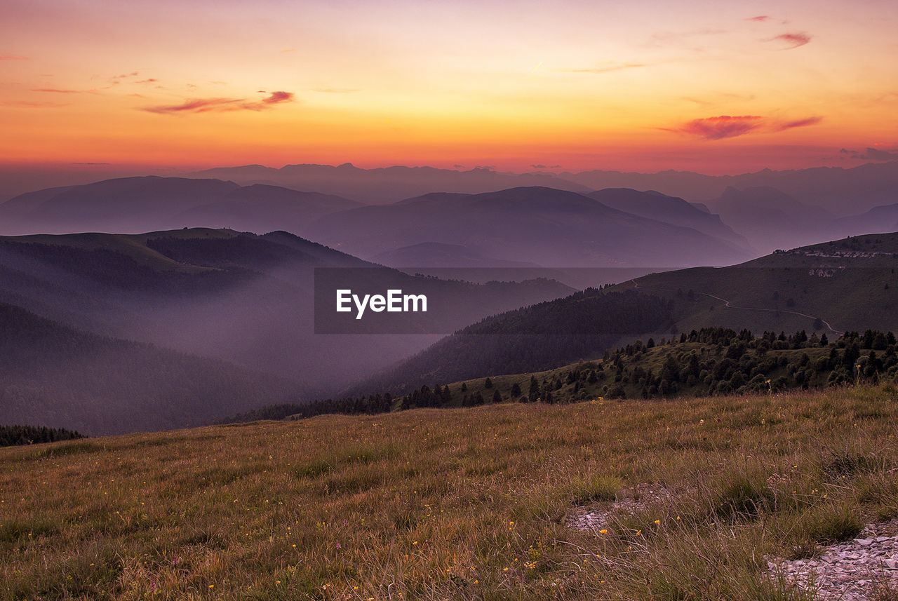 Scenic view of mountains against sky during sunset