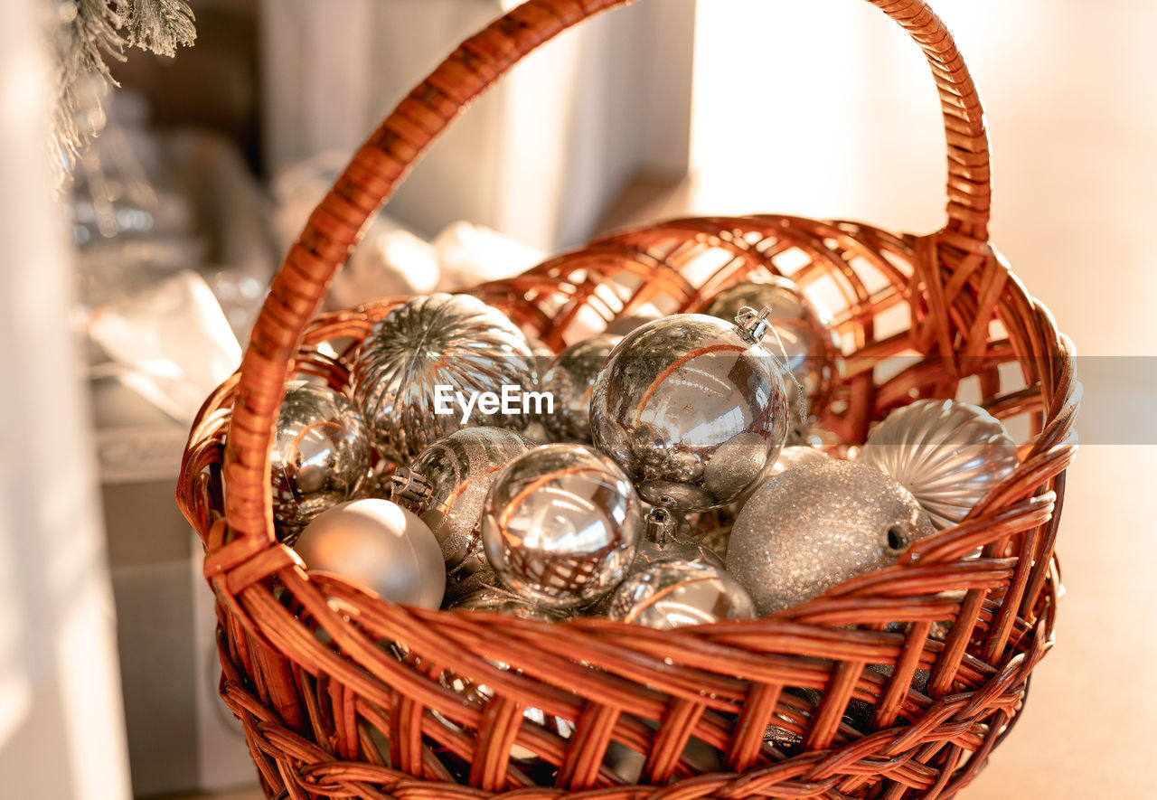Wicker basket with christmas decorations. festive mood