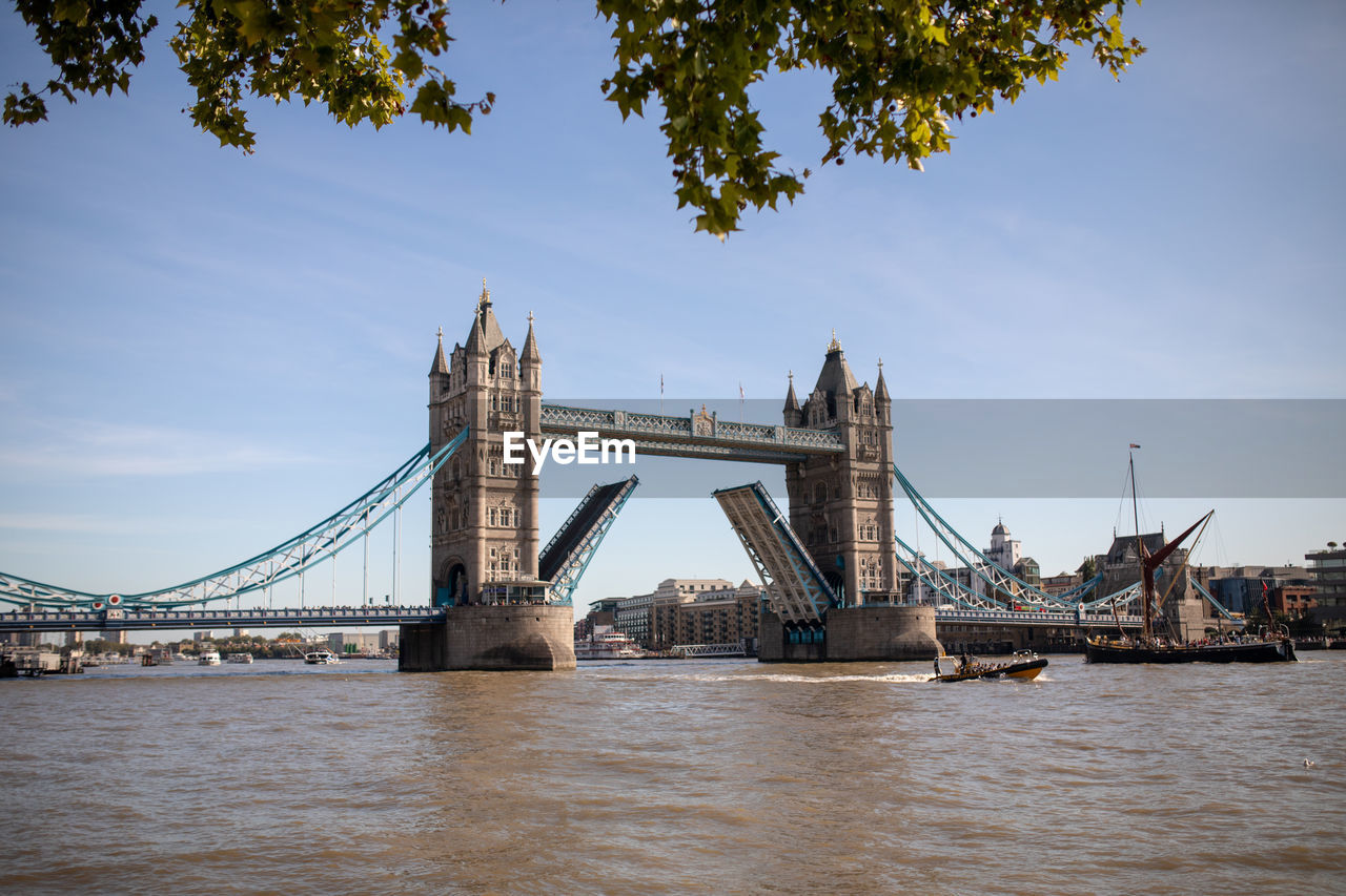 View of bridge over river in city