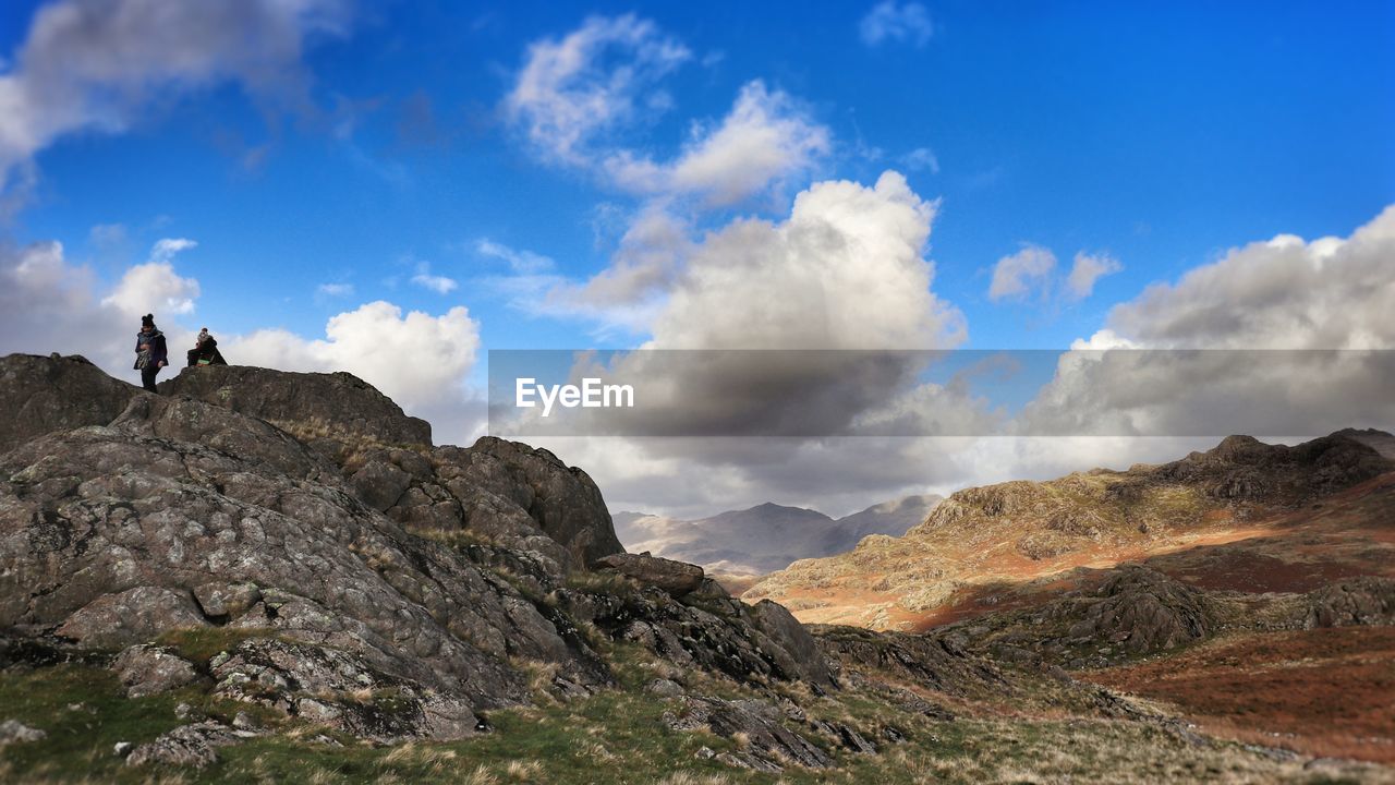 Low angle view of rocks on mountain against sky