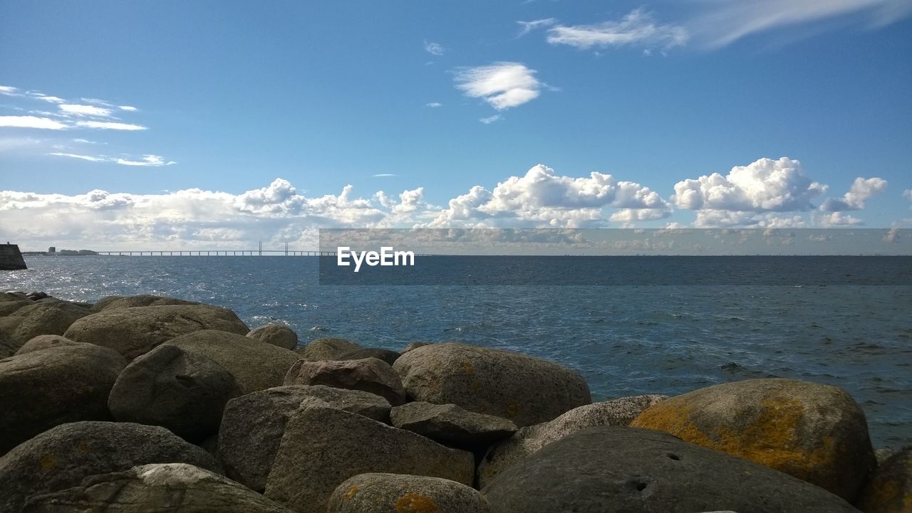Scenic view of sea against cloudy sky