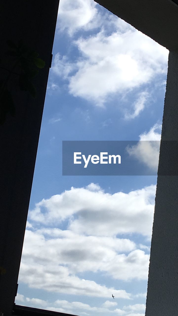 LOW ANGLE VIEW OF BUILDING AND SKY