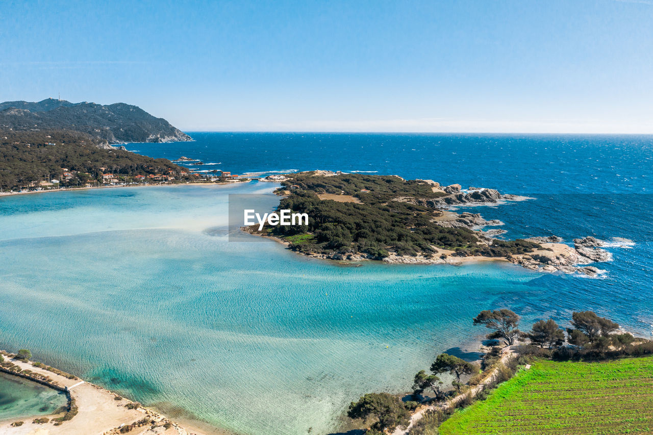 Scenic view of sea against clear blue sky