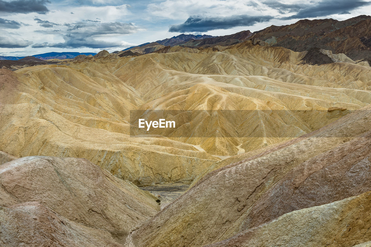 Scenic view of barren landscape against sky