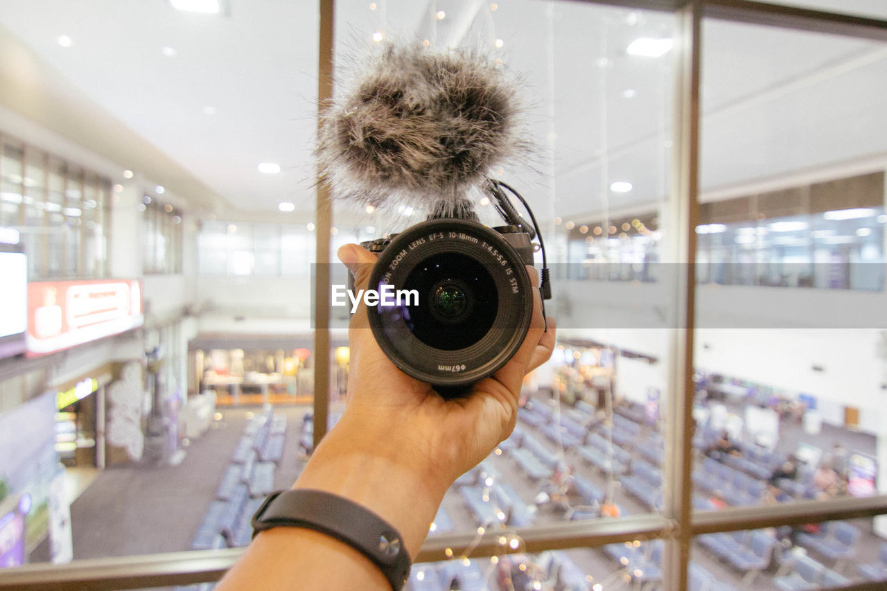 MAN PHOTOGRAPHING WITH CAMERA