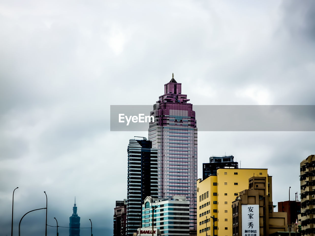 architecture, building exterior, built structure, city, sky, building, skyline, cityscape, office building exterior, urban area, skyscraper, cloud, landscape, tower, tower block, urban skyline, metropolitan area, horizon, nature, metropolis, travel destinations, residential district, landmark, no people, office, city life, downtown district, outdoors, travel, downtown, overcast, development, dusk, evening, dramatic sky, business