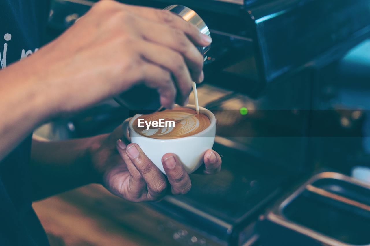 Close-up of woman holding coffee cup