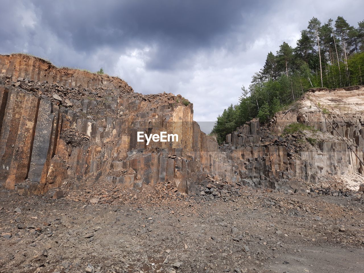 Rock formations on landscape against sky