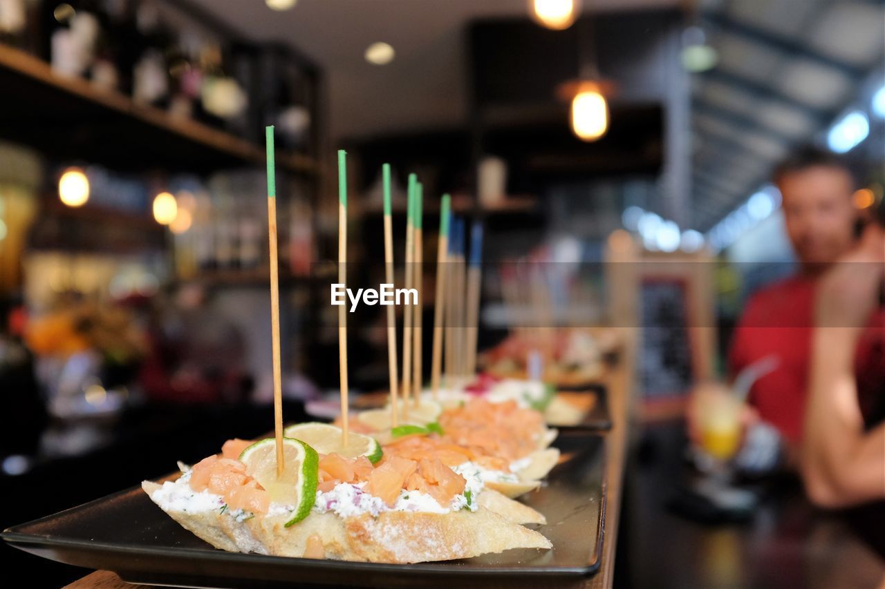 Foods in plates on bar counter