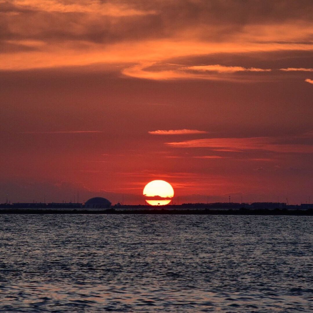 SCENIC VIEW OF SUNSET OVER SEA