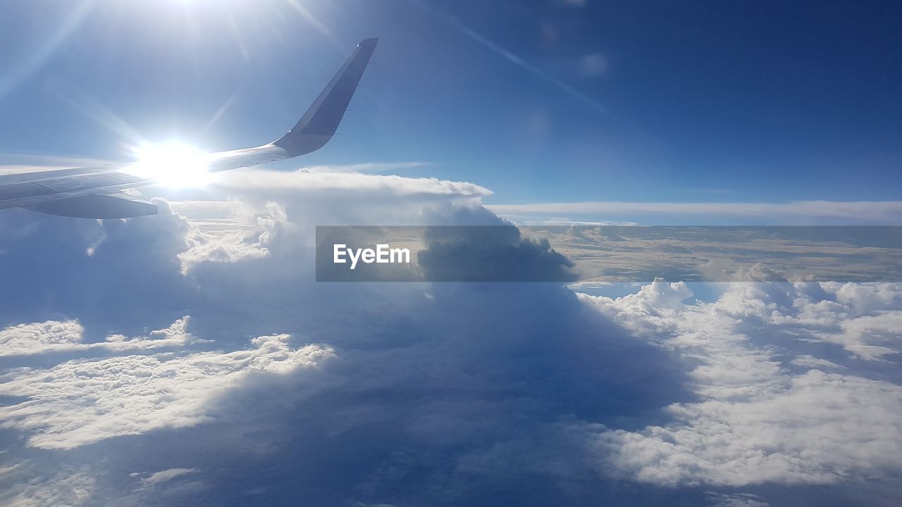 AERIAL VIEW OF CLOUDSCAPE OVER AIRPLANE