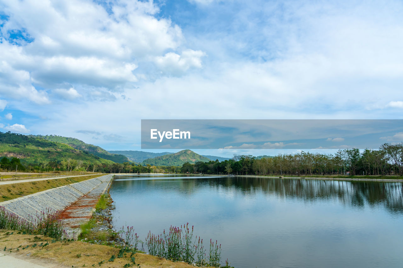 water, sky, cloud, reflection, scenics - nature, lake, reservoir, nature, environment, beauty in nature, landscape, body of water, plant, tree, tranquility, tranquil scene, mountain, no people, land, travel destinations, travel, outdoors, day, non-urban scene, blue, forest, tourism, shore, rural scene, idyllic, mountain range, summer, rural area