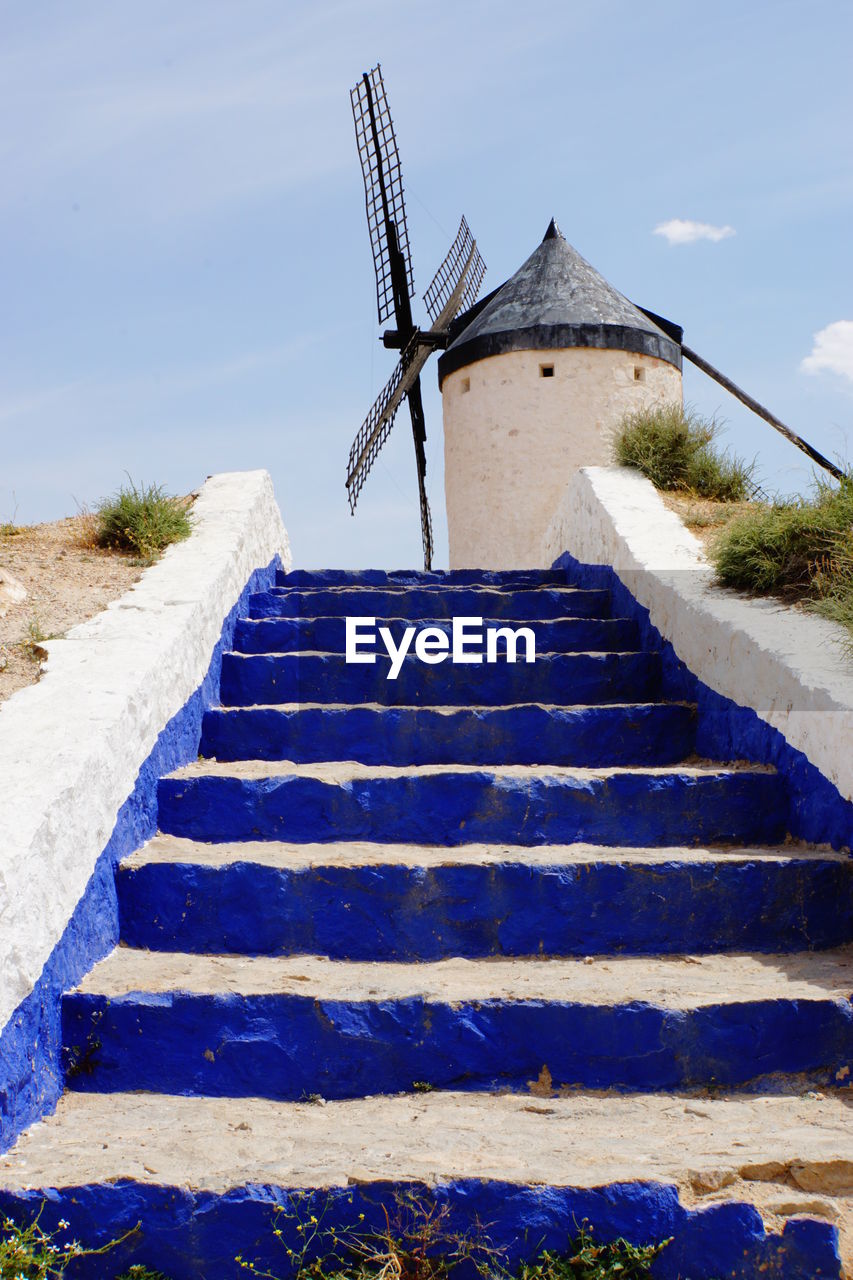 LOW ANGLE VIEW OF STAIRS AGAINST THE SKY