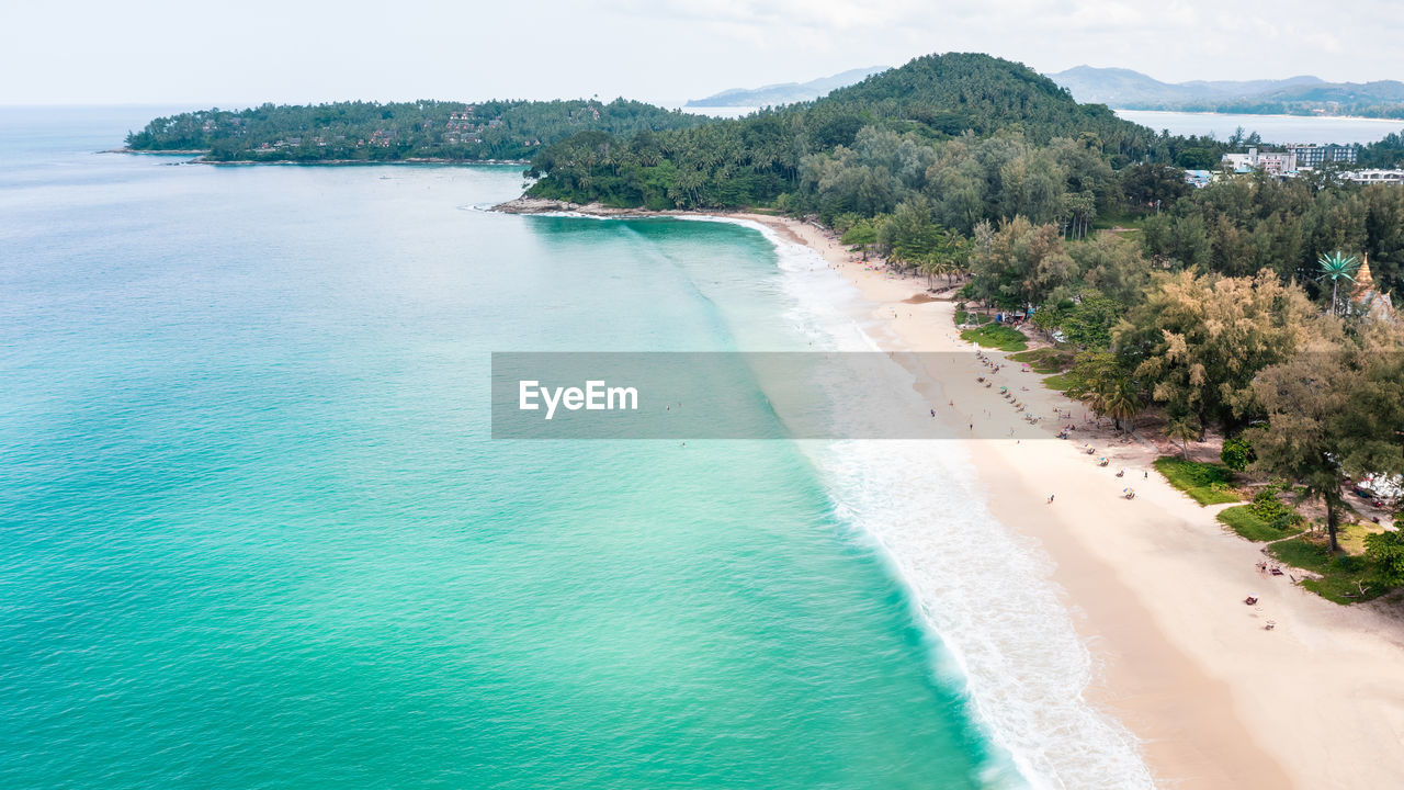 Aerial landscape view surin beach and small tourist on the sand beach at summer holiday phuket 