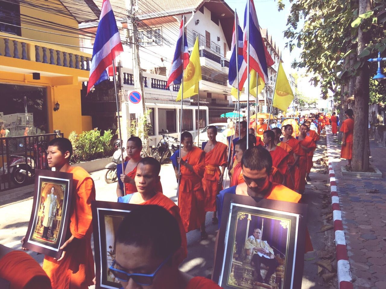 PANORAMIC VIEW OF PEOPLE WALKING AT FLAGS