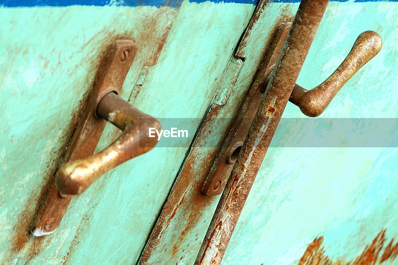 Close-up of rusty door handles