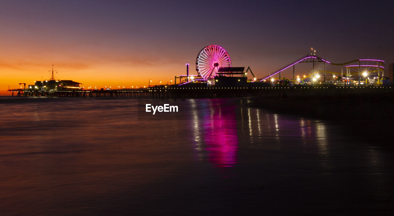 View of illuminated ferris wheel at night