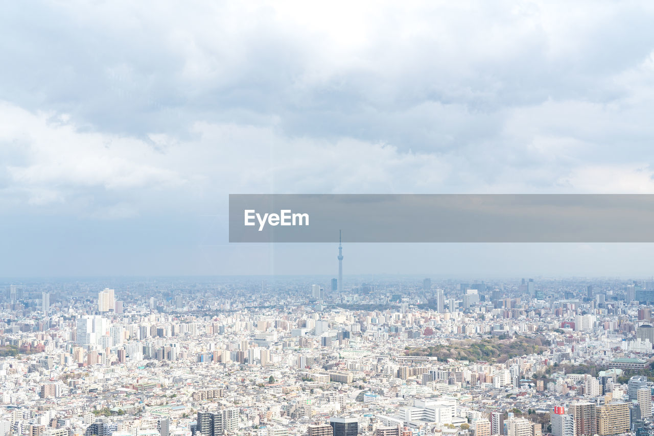 HIGH ANGLE VIEW OF CITY AGAINST SKY