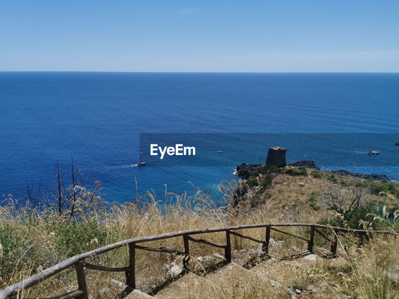 High angle view of sea against blue sky