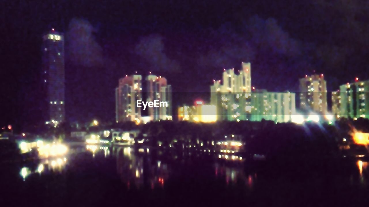 VIEW OF ILLUMINATED BUILDINGS AT NIGHT