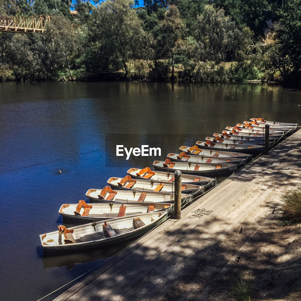 High angle view of rowboats moored at lake