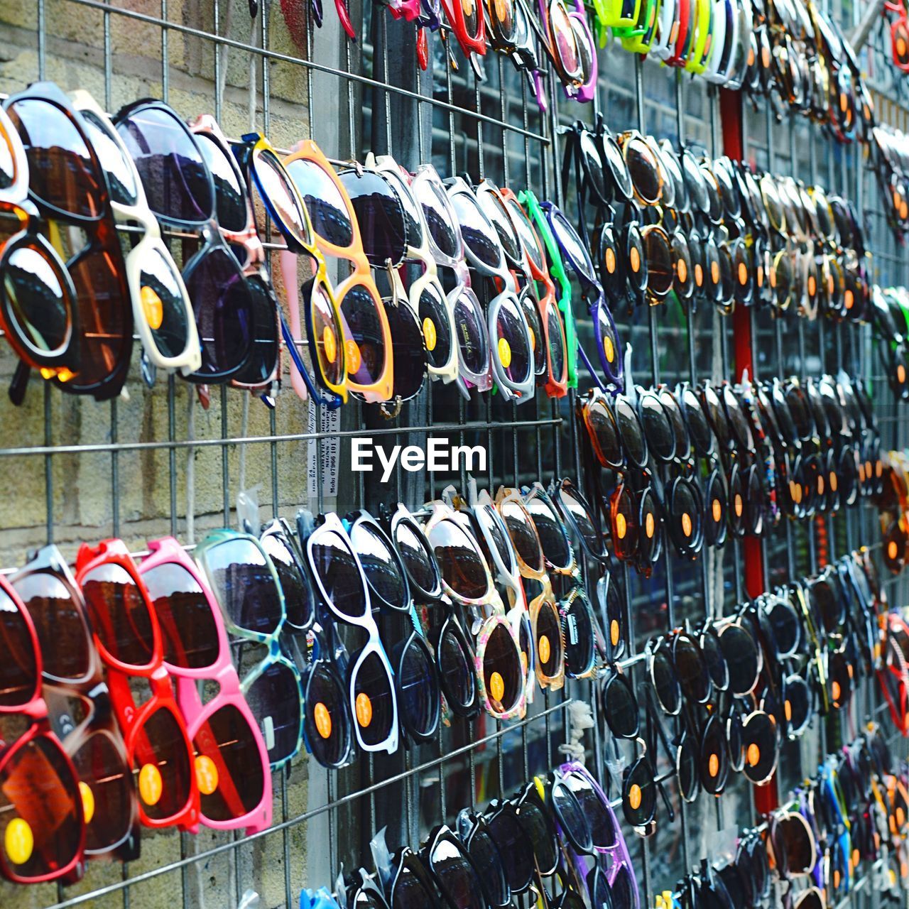 Row of sunglasses for sale in market