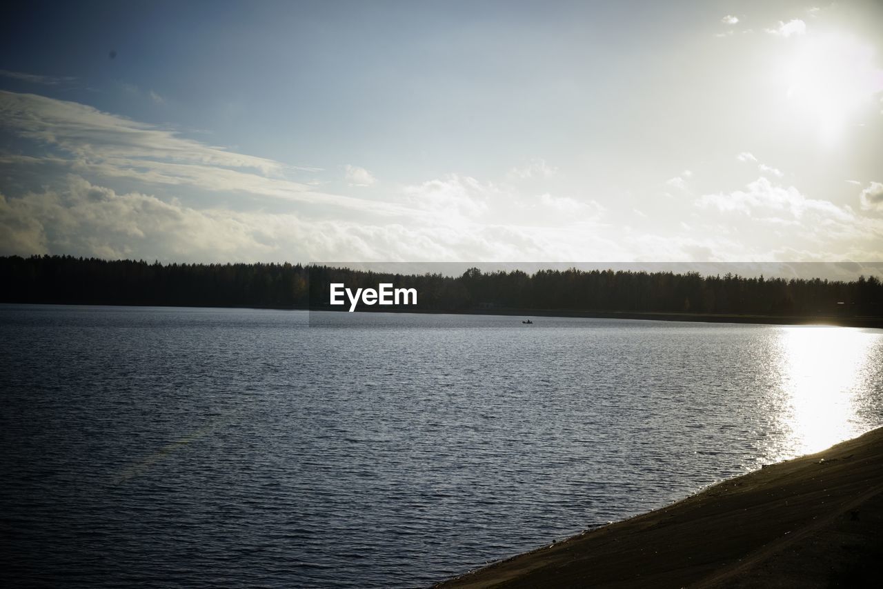 SCENIC VIEW OF LAKE AGAINST SKY IN FOREST