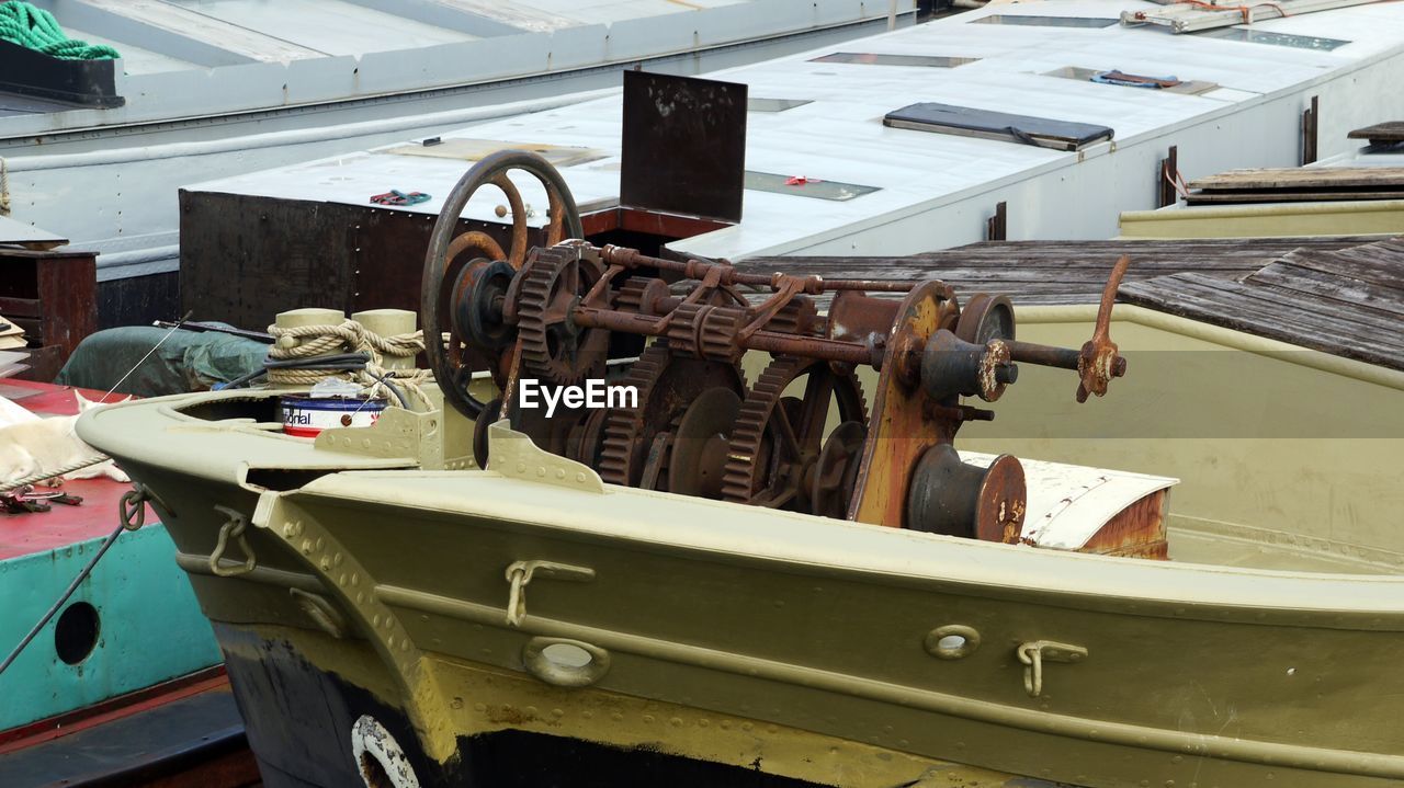 Rusty machinery on boat at factory