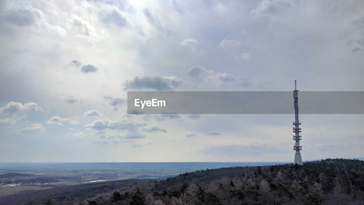 Aerial view of communications tower against sky