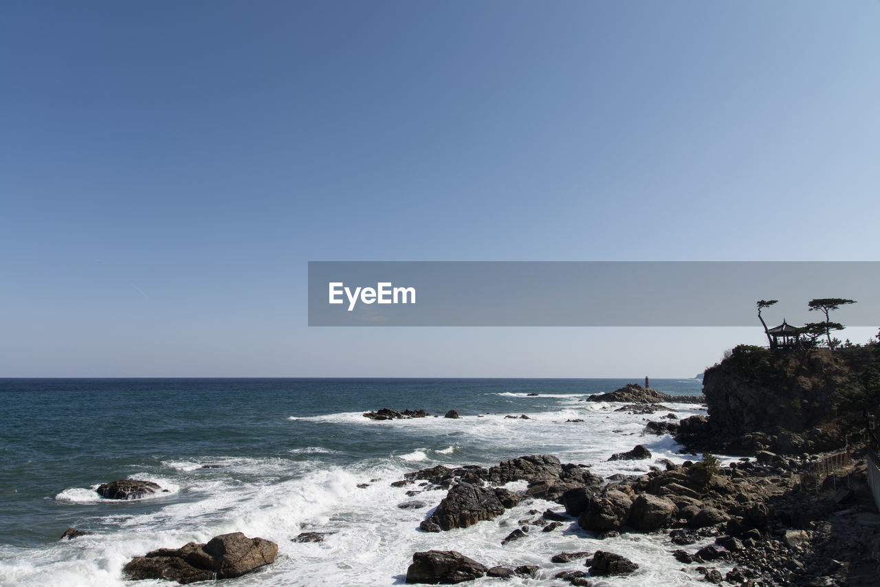 Scenic view of sea against clear sky