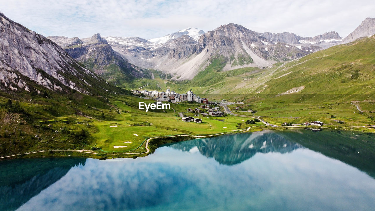 Scenic view of lake and mountains against sky