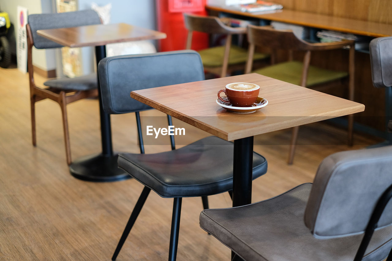 Coffee cup on table at cafe