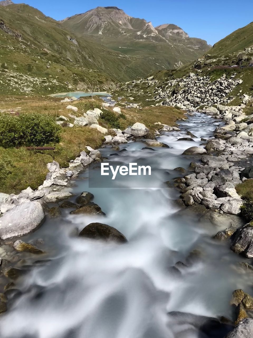 SCENIC VIEW OF STREAM AGAINST SKY