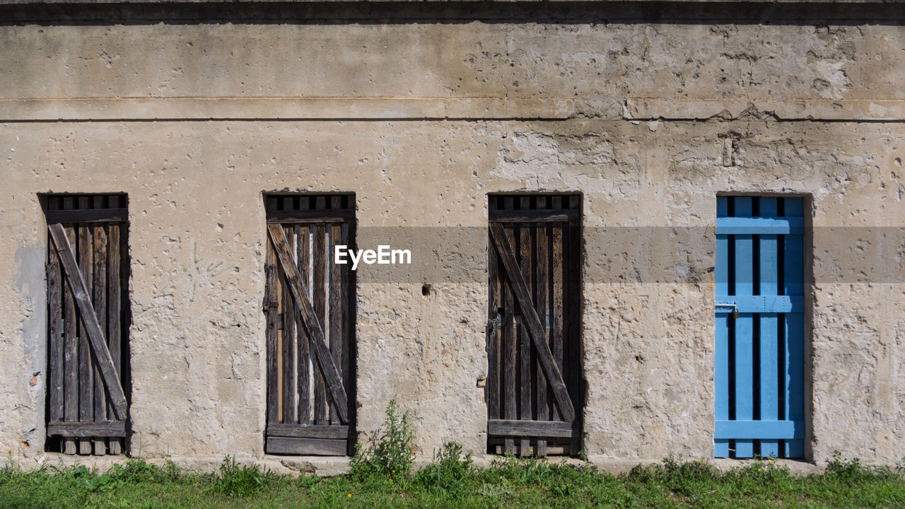 Closed wooden doors of old building