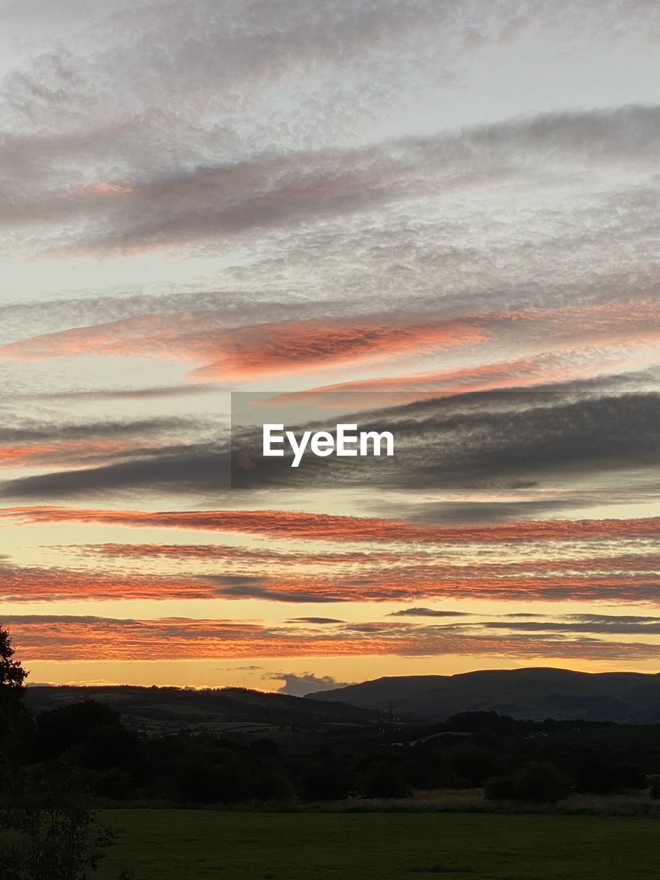 SCENIC VIEW OF DRAMATIC SKY OVER LANDSCAPE